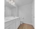 Bright bathroom with double sink vanity, tile flooring, toilet, and door at 3304 Candytuft Dr., Conway, SC 29526