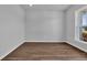 Empty bedroom with neutral walls, wood-look floors, and natural light at 3304 Candytuft Dr., Conway, SC 29526