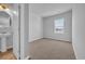 Bright bedroom boasts lake views from a window, with neutral carpet and paint at 3304 Candytuft Dr., Conway, SC 29526