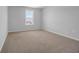 Well-lit bedroom with neutral carpet and lake views from the bright window at 3304 Candytuft Dr., Conway, SC 29526