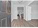 Inviting foyer with wood-look floors, leading to an open-concept living space at 3304 Candytuft Dr., Conway, SC 29526