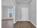 Bright entryway featuring wood-look floors and view to a living area at 3304 Candytuft Dr., Conway, SC 29526