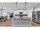 Bright kitchen features a large island, modern appliances, and stylish backsplash at 3304 Candytuft Dr., Conway, SC 29526