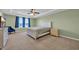 Airy main bedroom with tray ceiling, fan, en suite, and a beautiful window view at 3304 Candytuft Dr., Conway, SC 29526