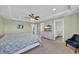 Inviting main bedroom features ceiling fan, TV, and en suite bathroom at 3304 Candytuft Dr., Conway, SC 29526