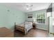 Charming bedroom featuring a ceiling fan, window with blinds, and stylish decor at 4305 Lotus Ct. # G, Murrells Inlet, SC 29576