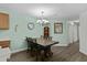 Cozy dining area features a rustic wood table, decorative chandelier, and stylish flooring at 4305 Lotus Ct. # G, Murrells Inlet, SC 29576