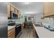 Well-equipped kitchen with stainless steel appliances and a view of the adjacent dining area at 4305 Lotus Ct. # G, Murrells Inlet, SC 29576