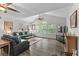 Spacious living room with vaulted ceilings, large windows, and comfortable seating area at 4305 Lotus Ct. # G, Murrells Inlet, SC 29576