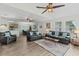Open-concept living room with modern furnishings and seamlessly connecting kitchen and dining areas at 4305 Lotus Ct. # G, Murrells Inlet, SC 29576