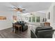 Bright living room featuring vaulted ceilings, natural light, and a cozy seating arrangement at 4305 Lotus Ct. # G, Murrells Inlet, SC 29576