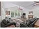 Inviting living room with vaulted ceilings, large windows, and a cozy fireplace at 4305 Lotus Ct. # G, Murrells Inlet, SC 29576