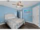 Bright main bedroom with a ceiling fan, ensuite bathroom, and ample natural light at 4305 Lotus Ct. # G, Murrells Inlet, SC 29576