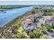 Aerial view of waterfront condos, showcasing serene riverfront location and lush greenery at 4616 Greenbriar Dr. # H8, Little River, SC 29566