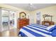 A bright bedroom boasts stylish décor and access to a lanai at 4616 Greenbriar Dr. # H8, Little River, SC 29566