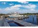 Casino boat docked at wooden pier with calm water reflecting bright blue sky with fluffy white clouds at 4616 Greenbriar Dr. # H8, Little River, SC 29566