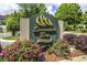 Spinnaker Bay at Eastport community sign with mature landscaping, flowers, and trees at 4616 Greenbriar Dr. # H8, Little River, SC 29566
