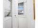 This home has a laundry area with a washer, dryer, and a bright window at 4616 Greenbriar Dr. # H8, Little River, SC 29566