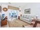 Comfortable living room with access to sun room overlooking the waterway at 4616 Greenbriar Dr. # H8, Little River, SC 29566