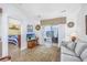 Inviting living room with access to the waterway-view sun room and cozy bedroom at 4616 Greenbriar Dr. # H8, Little River, SC 29566