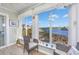 Inviting sun room with large windows offering panoramic views of the waterway at 4616 Greenbriar Dr. # H8, Little River, SC 29566