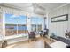Relaxing sun room featuring comfortable seating and scenic views of the waterway at 4616 Greenbriar Dr. # H8, Little River, SC 29566