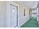 This home features an exterior walkway with an outdoor carpet and lake views at 4616 Greenbriar Dr. # H8, Little River, SC 29566