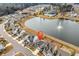 Aerial view with neighborhood landmark showing community pool and lake with fountain at 511 Mcalister Dr., Little River, SC 29566