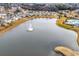 Beautiful aerial view of a lake featuring a fountain at 511 Mcalister Dr., Little River, SC 29566