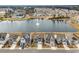 Aerial view of the community featuring a central lake with a fountain and multiple residential homes at 511 Mcalister Dr., Little River, SC 29566