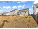 Expansive backyard view shows the fence line and neighboring houses at 511 Mcalister Dr., Little River, SC 29566
