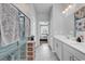 Bright bathroom featuring double sinks and a glass shower at 511 Mcalister Dr., Little River, SC 29566