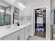 Elegant bathroom with dual sinks and walk-in closet at 511 Mcalister Dr., Little River, SC 29566