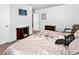 A well-lit bedroom provides a calm space with unique art and comfortable furnishings at 511 Mcalister Dr., Little River, SC 29566