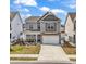 Charming two-story home with a well-maintained yard and a two-car garage at 511 Mcalister Dr., Little River, SC 29566