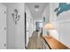 Hallway with wood floors and light walls leading into the living room at 511 Mcalister Dr., Little River, SC 29566