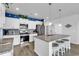 Open kitchen with a large island, stainless steel appliances, and wood flooring at 511 Mcalister Dr., Little River, SC 29566