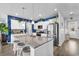 Kitchen featuring a large granite island, stainless appliances and beachy blue accent wall at 511 Mcalister Dr., Little River, SC 29566