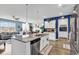 Bright kitchen with granite counters, stainless appliances, and open to the living area at 511 Mcalister Dr., Little River, SC 29566
