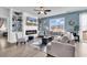 Cozy living room featuring a fireplace, built-in shelving, and ample natural light at 511 Mcalister Dr., Little River, SC 29566