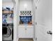 Mud Room featuring a built-in wine rack and storage space next to the laundry room at 511 Mcalister Dr., Little River, SC 29566