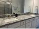 Bathroom features double sinks, granite countertops, and modern fixtures at 5834 Cremona Dr., Myrtle Beach, SC 29577