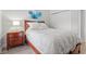 Well-lit bedroom with white bedding, a nightstand with lamp, and a closet with sliding doors at 5834 Cremona Dr., Myrtle Beach, SC 29577
