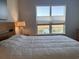 Bright bedroom with large windows and view of lake at 5834 Cremona Dr., Myrtle Beach, SC 29577