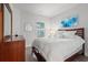 Cozy bedroom with a queen bed, dark wood furniture, and a window providing natural light at 5834 Cremona Dr., Myrtle Beach, SC 29577