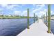 View of the long neighborhood dock on the water, with blue skies at 5834 Cremona Dr., Myrtle Beach, SC 29577