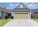 Charming home featuring a two-car garage, blue siding, and a well-manicured lawn at 5834 Cremona Dr., Myrtle Beach, SC 29577