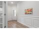 Inviting foyer with paneled wall accents and an eye-catching art piece at 5834 Cremona Dr., Myrtle Beach, SC 29577