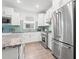 Modern kitchen with stainless steel appliances, granite countertops, and ample cabinet space at 5834 Cremona Dr., Myrtle Beach, SC 29577