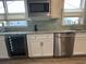 Stylish kitchen with stainless steel dishwasher and wine fridge at 5834 Cremona Dr., Myrtle Beach, SC 29577